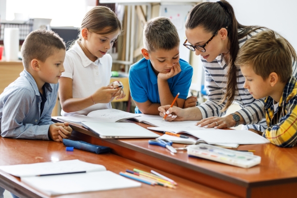 Young students with their teacher.