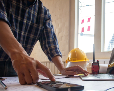 Contractor using a calculator.