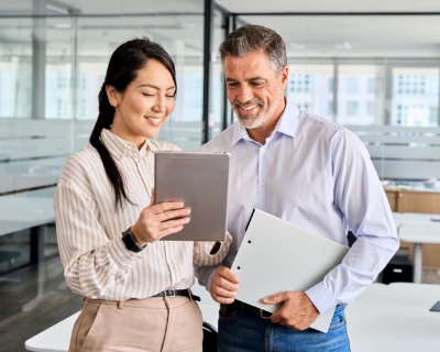 Man and a woman looking at documents.