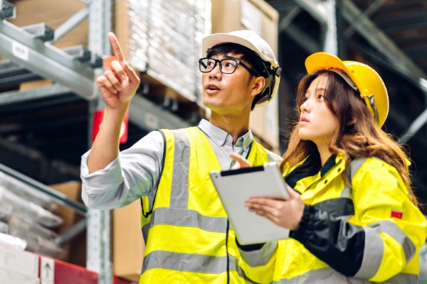 Woman and man reviewing inventory.